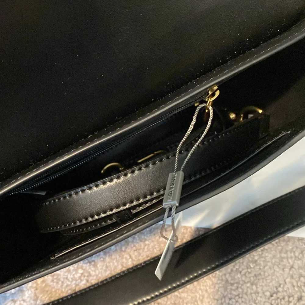 Charles & Keith Black Saddle Shoulder Bag with Gold Accent